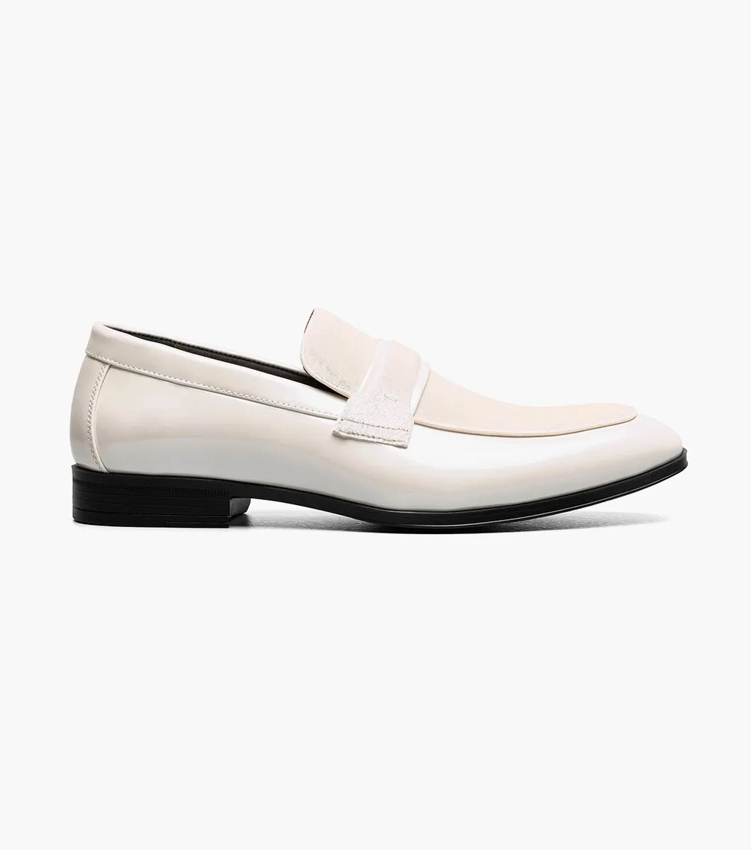 The STACY ADAMS Spratley Moc Toe Saddle Slip On in ivory features a cream velour upper with suede panel, low black heel, and almond toe for a sophisticated men's loafer.