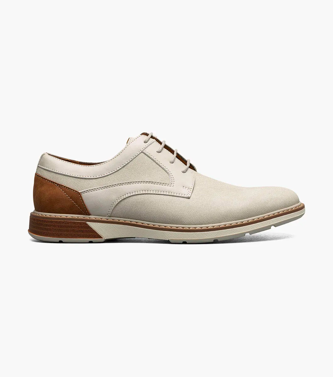The Stacy Adams Phineas Plain Toe Oxford in sand features a stylish upper, tan leather heel accent, cushioned insole, and brown sole, shown against a plain white background.