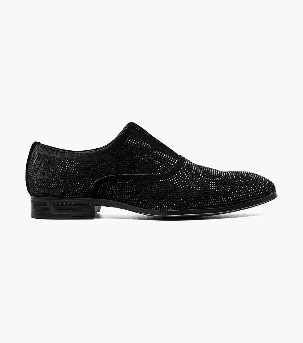 The Stacy Adams Starleigh Rhinestone Plain Toe Slip On (Black, 25685-001) is a men's black slip-on dress shoe with a low heel, rounded toe, cushioned footbed, and small silver rhinestones across the upper.