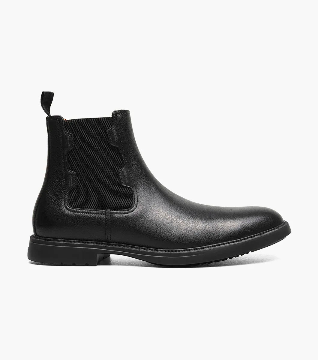 The STACY ADAMS Townsend Plain Toe Chelsea Boot (25728-007) in black tumbled leather features elastic side panels, a back pull tab, cushioned footbed, and low heel.