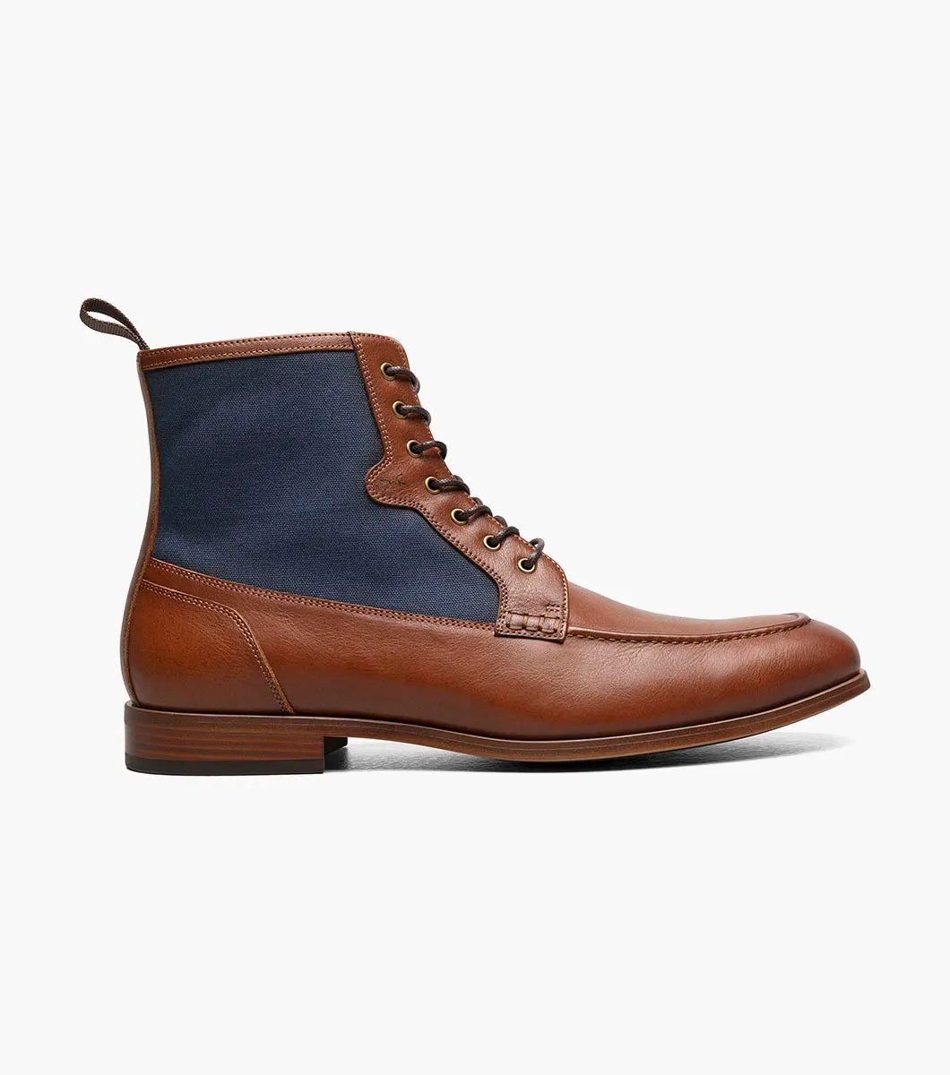 The STACY ADAMS Brumley Moc Toe Lace Up Boot in Tan Multi features burnished leather and navy fabric, a low wooden heel, cushioned footbed, and fabric pull tab.