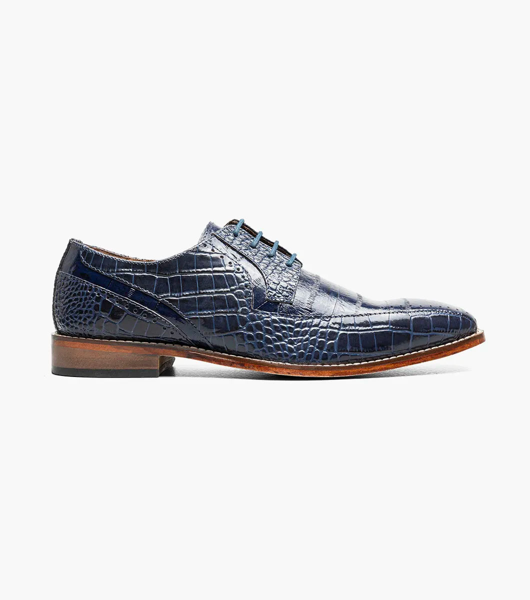 The Stacy Adams Talamanco Bike Toe Oxford (style 25788-400) is a single blue crocodile print leather dress shoe with a bike toe, brown sole, and RedZone footbed by STACY ADAMS, displayed on a white background.