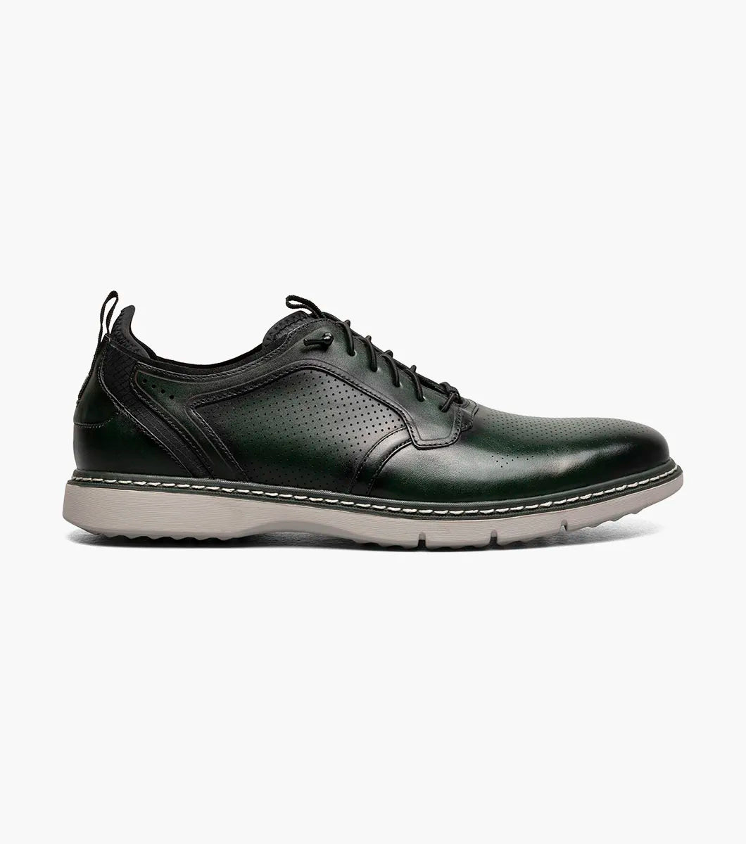 The STACY ADAMS Sync Plain Toe Elastic Lace Up in green (25662-300) features dark green leather, perforated detailing, black elastic laces, a RedZone footbed, and a light gray sole, shown on a white background.
