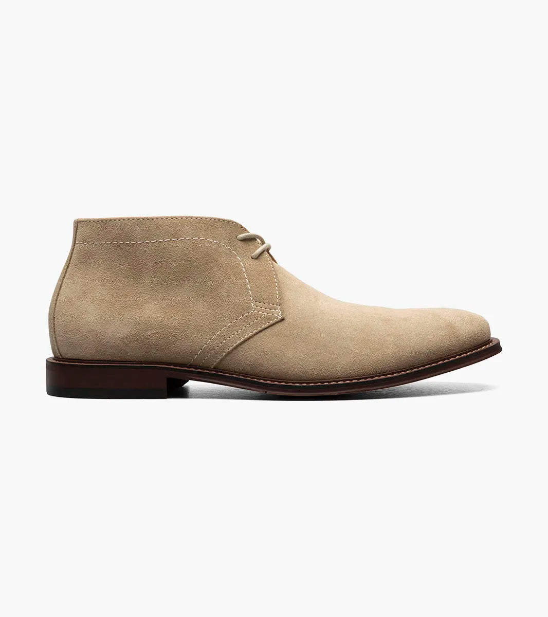 The Stacy Adams Martfield Plain Toe Chukka Boot in Sand features a tan suede upper, two eyelets, light brown laces, visible stitching, and a brown rubber sole.