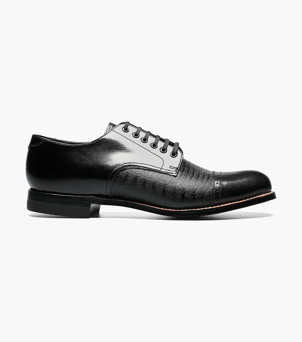 The Stacy Adams Madison Lizard Cap Toe Oxford (00049-01) is a black kidskin leather dress shoe for men, featuring a lizard print cap toe and five eyelets, shown against a white background. Brand: STACY ADAMS.