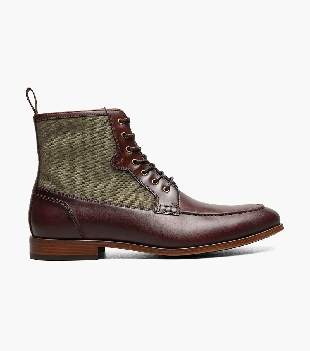 The Stacy Adams Brumley Moc Toe Lace Up Boot in Brown Multi features burnished leather and olive green fabric, a lace-up closure, cushioned footbed, and low stacked heel for lasting comfort and style.