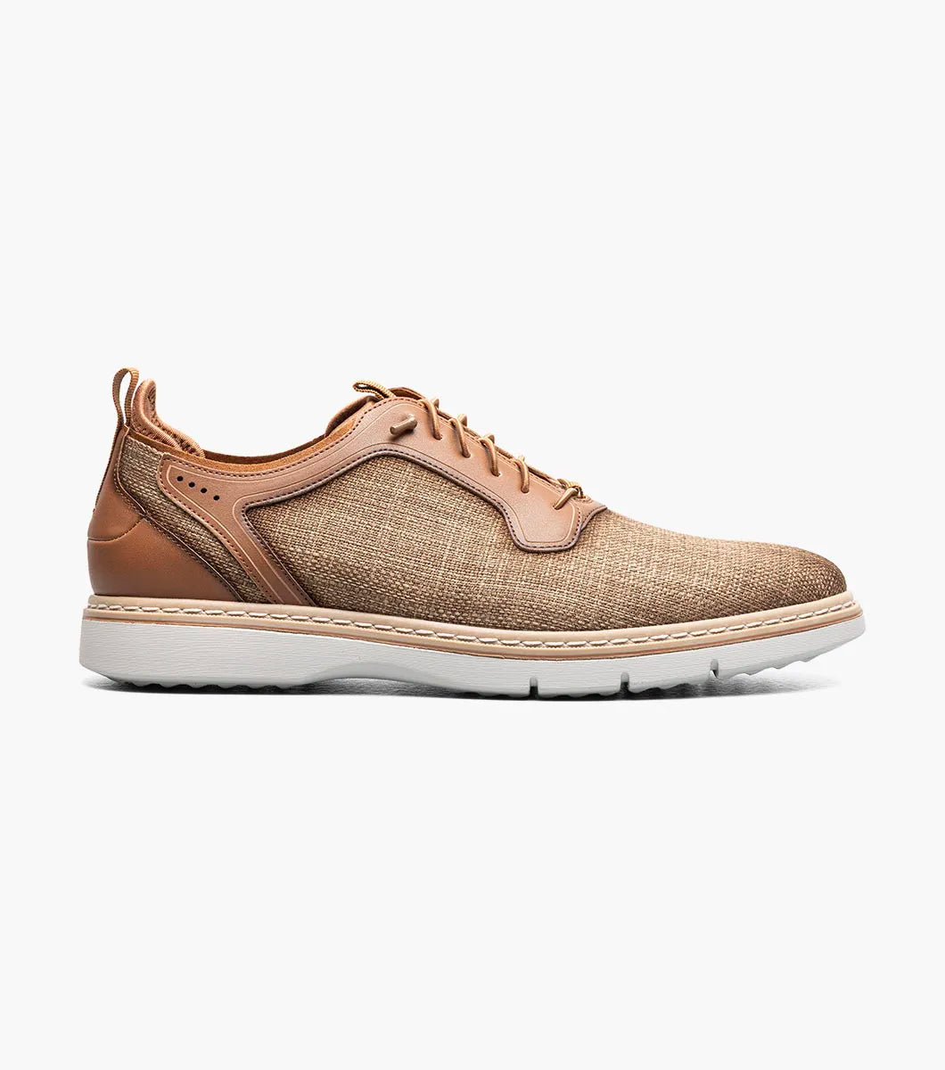 The Stacy Adams Sebert Plain Toe Elastic Lace Up in tan features a textured fabric upper, leather accents, anatomical arch support, and a light rubber sole for comfort, shown on a white background.