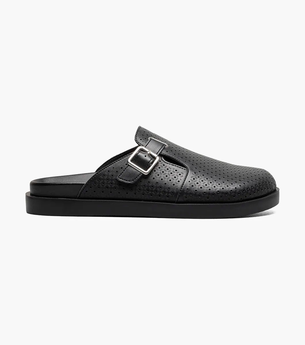 The Stacy Adams Montaine Strap Sandal in black (25696-001) features a perforated leather upper, leather linings, a side buckle, and a flat sole, displayed on a plain white background.