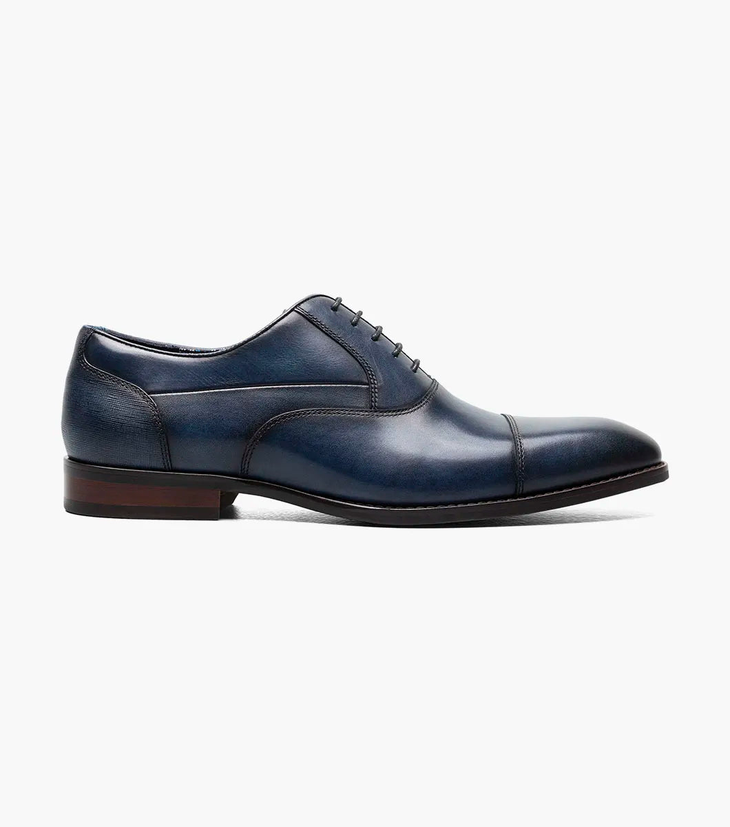 The STACY ADAMS Kallum Cap Toe Oxford (Navy, 25568-410) features a shoe insole with labeled features: molded heel cup, anatomical arch support, and cushioned heel pod—ideal for penny slip-on or suede loafer styles.