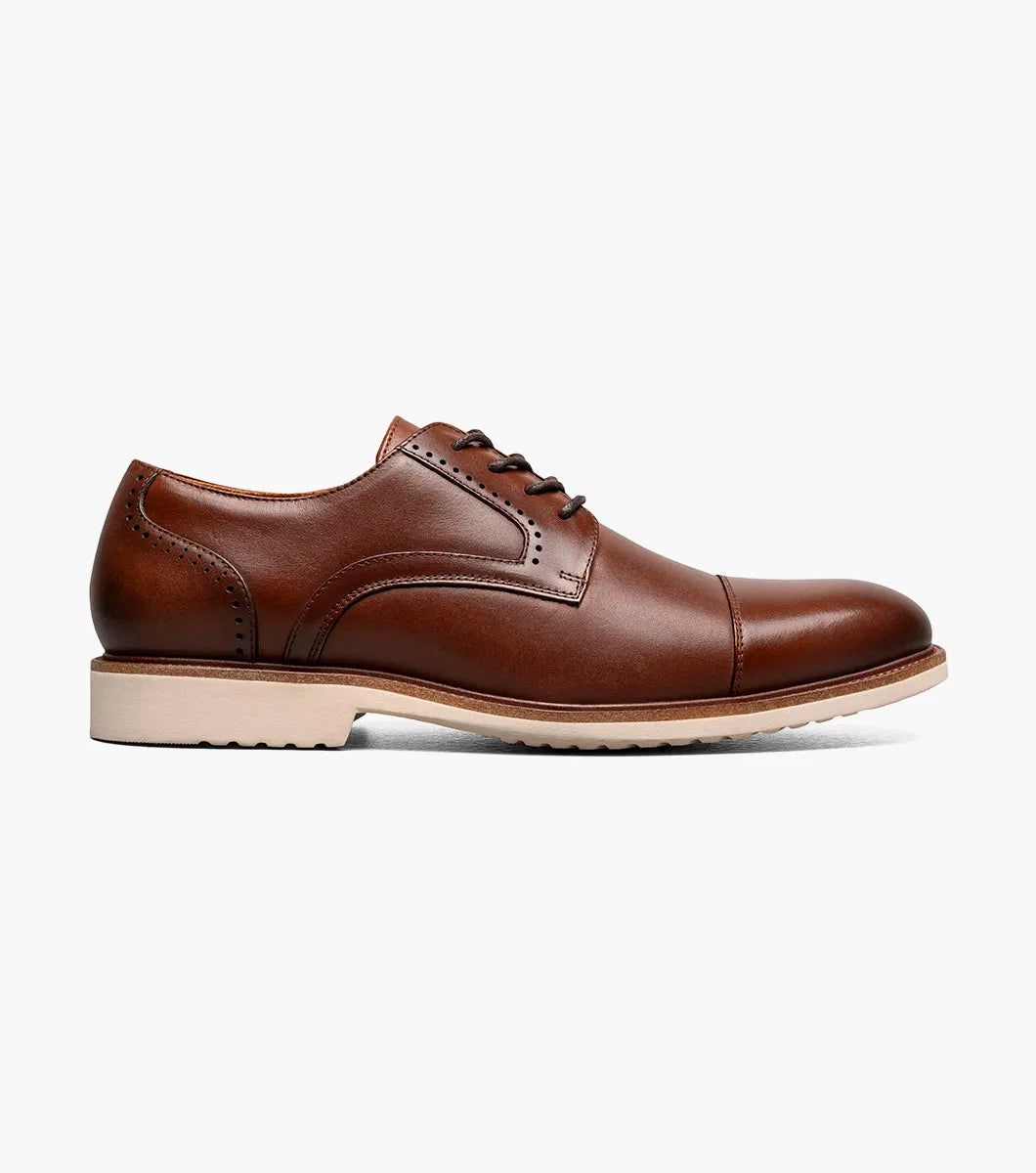 The Stacy Adams Wesbridge Cap Toe Oxford in chocolate features burnished leather, a tan sole, black laces, and anatomical arch support. Displayed on a white background. Brand: STACY ADAMS.