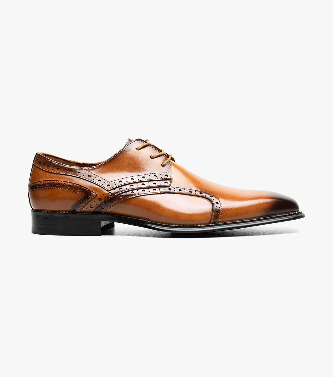 The Stacy Adams Alexander Plain Toe Oxford in tan (25791-240) is a single men’s dress shoe made from brown calf leather, featuring elegant brogue detailing and laces. Photographed against a white background, it offers enhanced comfort with Memory Foam cushioning.
