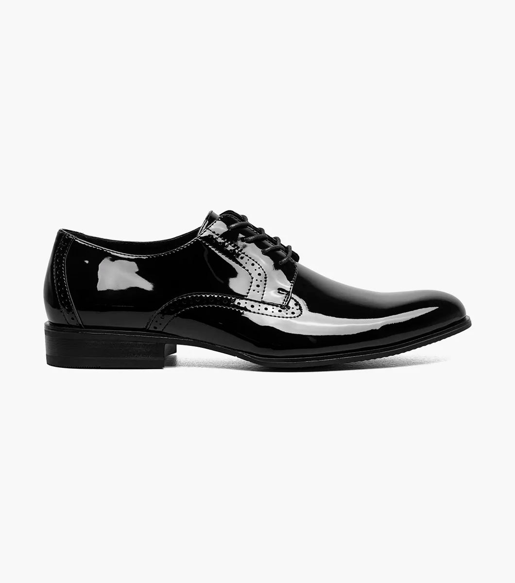 The STACY ADAMS Scottie Plain Toe Oxford (Black Patent, 25701-004) is a black patent leather lace-up dress shoe with anatomical arch support, shown in side profile against a white background.
