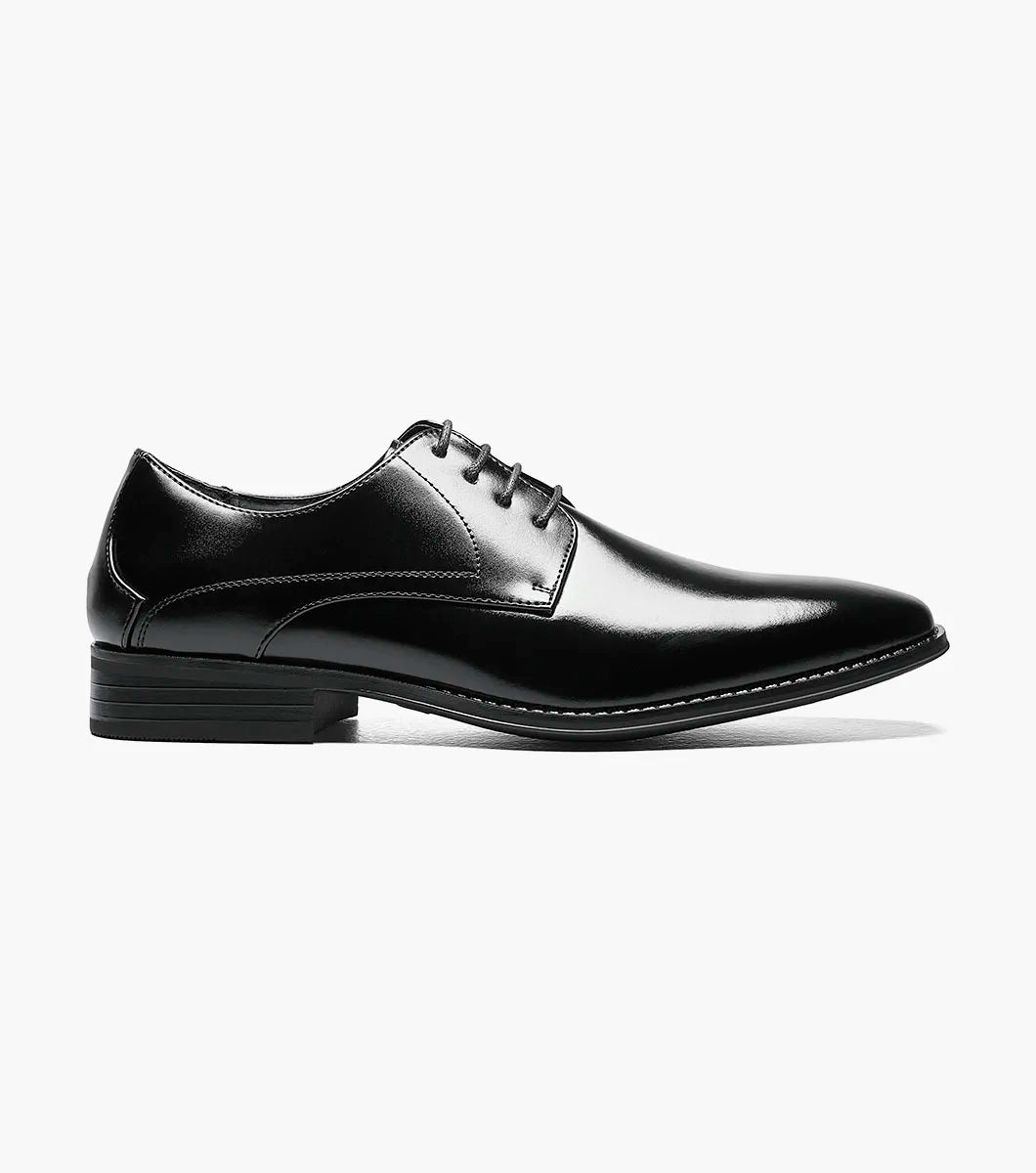 The STACY ADAMS Wayde Plain Toe Oxford (Black, 20144-001) is a leather lace-up dress shoe with a low heel, cushioned footbed, and polished finish, shown here on a plain white background.
