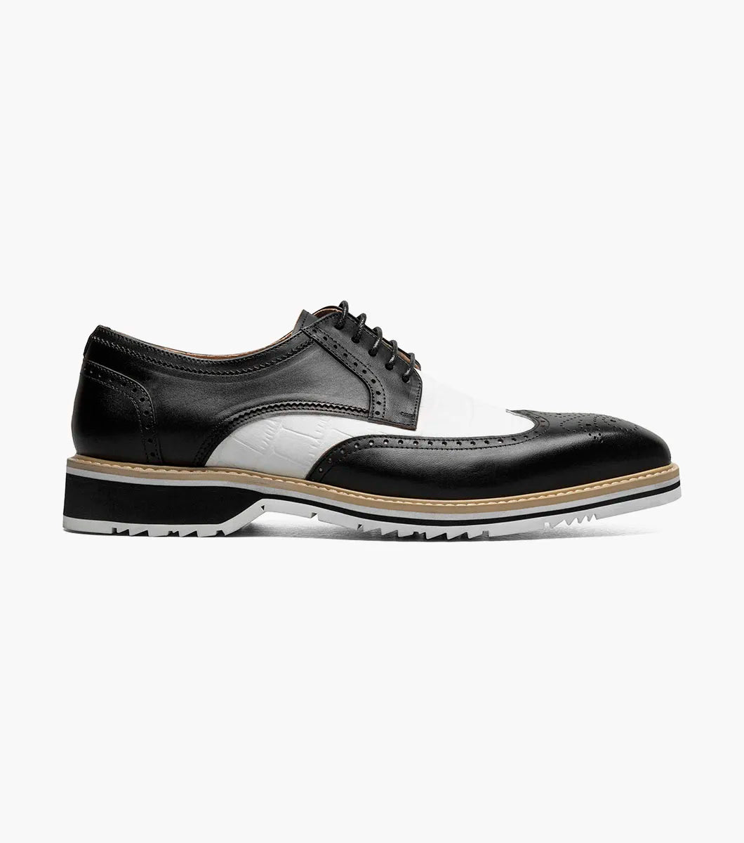 The STACY ADAMS Beaumont Wingtip Oxford (Black w/White, 25723-111) features leather linings, decorative perforations, wingtip styling, and a contrasting sole, shown in side profile on a white background.