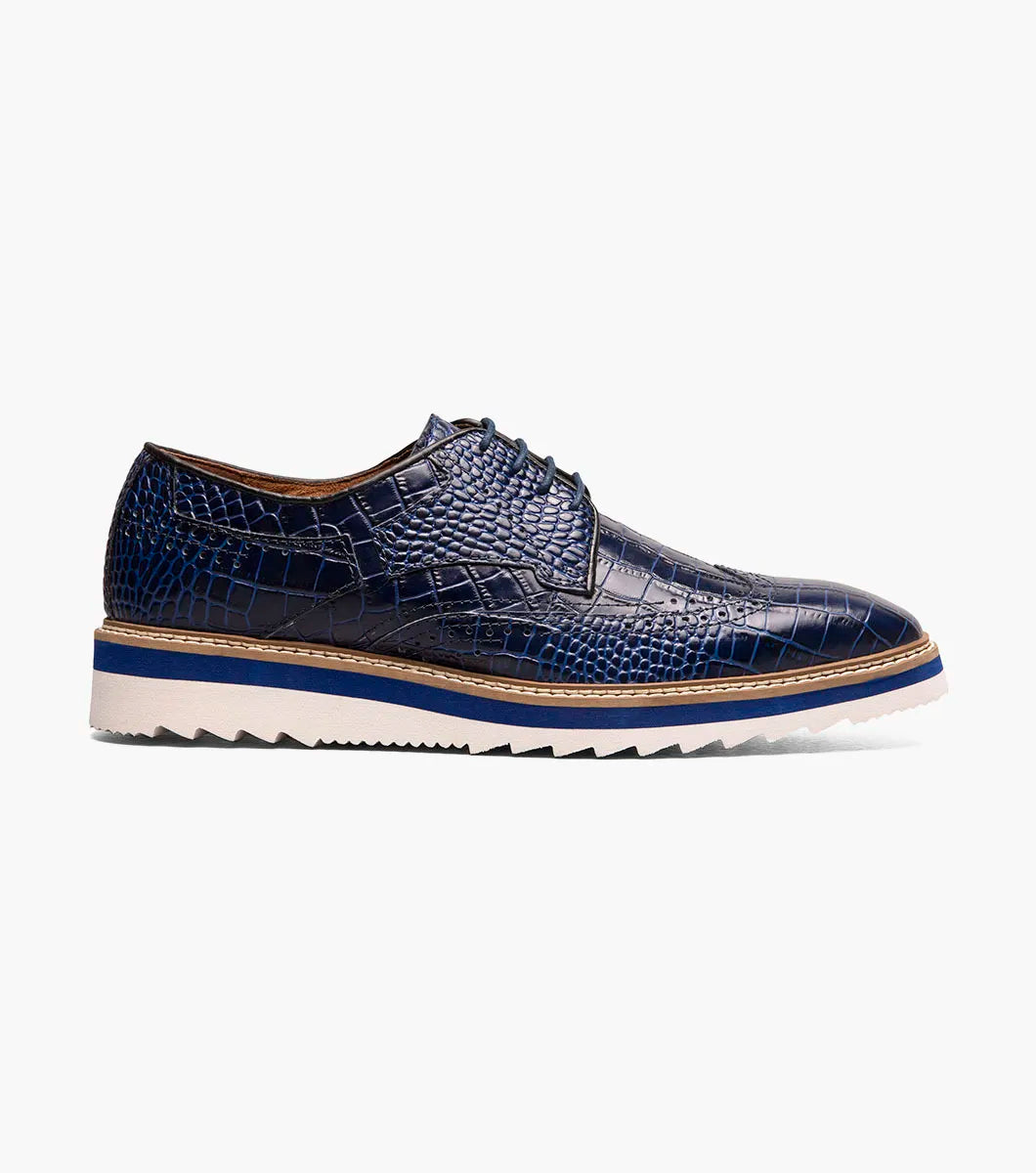 The Stacy Adams Alario Wingtip Oxford in Blue features a RedZone removable footbed with “Stacy Adams” labeling, molded heel cup, anatomical arch support, and cushioned heel pod for comfort in every step.