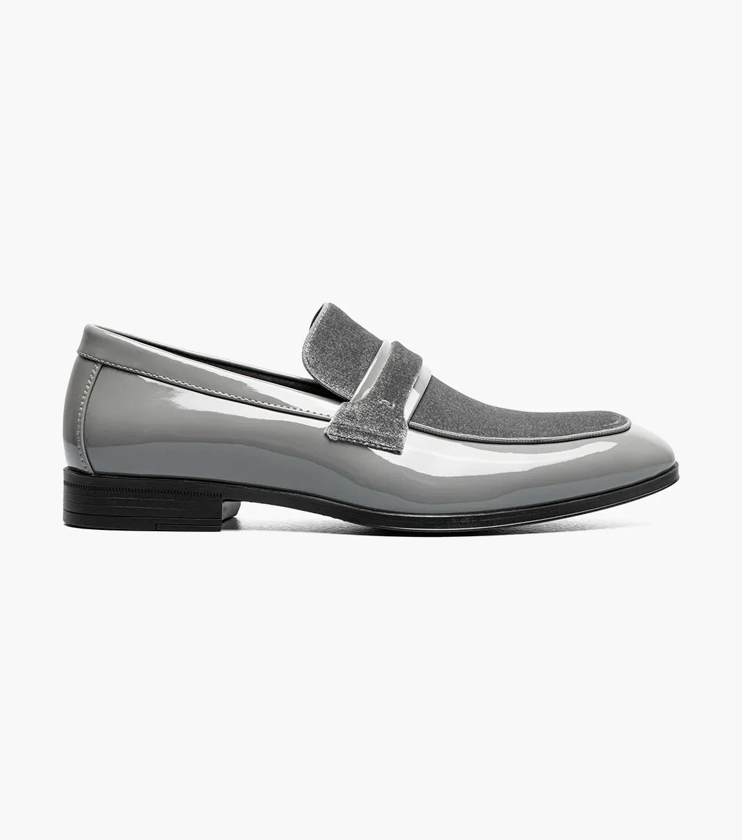 The STACY ADAMS Spratley Moc Toe Saddle Slip On in gray (25686-020) features a velour upper with a shiny patent finish, moc toe slip-on design, low heel, and rounded toe.