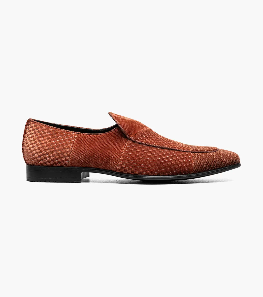 The STACY ADAMS Shapshaw Velour Moc Toe Slip On in Cognac (25642-221) features brown textured leather, a cushioned insole, and a low black heel, displayed against a plain white background.