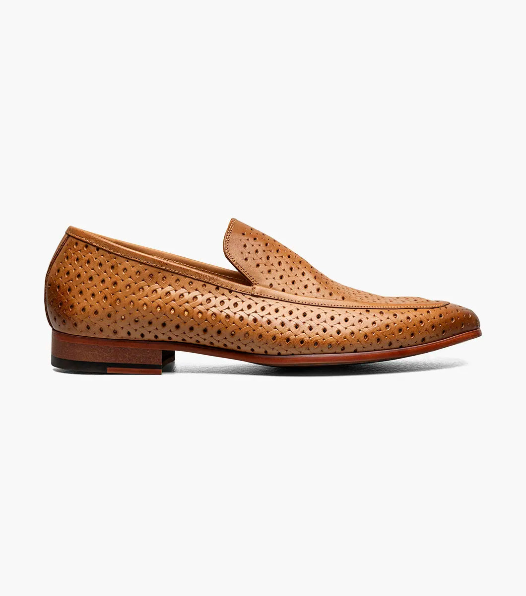 The STACY ADAMS Winden Moc Toe Perf Slip On in Natural (25645-280) is a men's summer shoe with perforations, memory foam insole, low stacked heel, and a sleek silhouette. Shown on a white background.