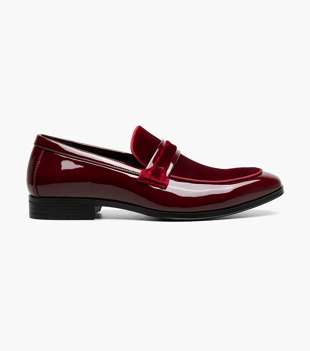 The STACY ADAMS Spratley Moc Toe Saddle Slip On (Burgundy, 25686-601) is a men's loafer with a low heel, combining a velour upper, suede vamp, and glossy patent leather finish.