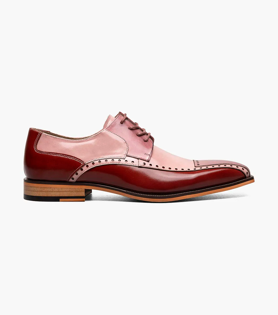 The Stacy Adams Plaza Modified Cap Toe Oxford (25608-640) features a red multi leather upper with brogue details, lace-up front, and brown stacked heel. Shown in side profile on a white background.