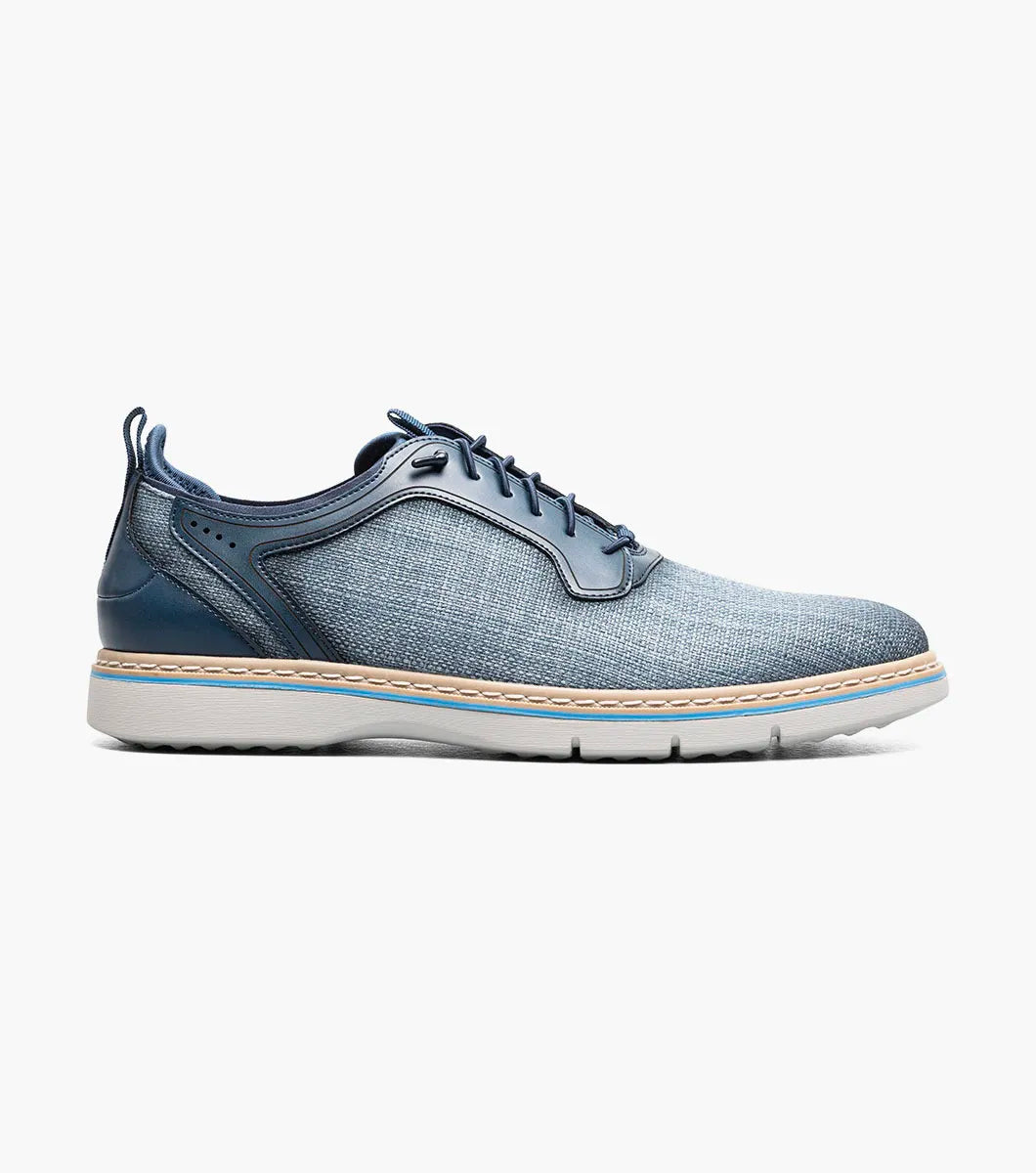 The Stacy Adams Sebert Plain Toe Elastic Lace Up in Navy (25771-410) features a textured upper, smooth leather accents, and a light rubber sole—offering stylish comfort for men. Shown on a plain white background.