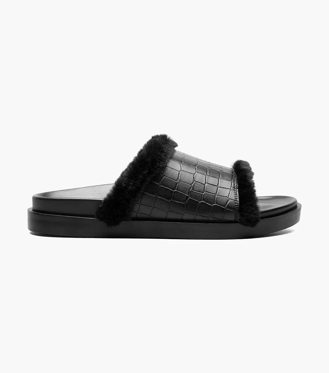 The Stacy Adams Monty Slide Sandal in black features a crocodile print faux leather upper, black faux fur trim, and an open toe on a flat sole.