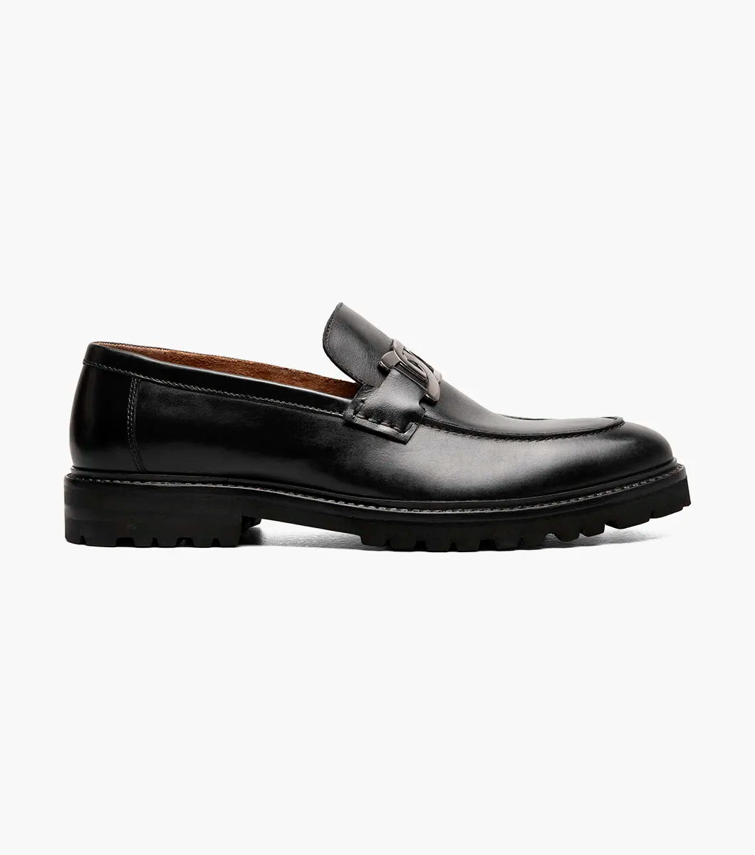 The Stacy Adams Hale Moc Toe Bit Slip On in black features crocodile print leather and a removable RedZone footbed, paired perfectly with an insole offering a molded heel cup, anatomical arch support, and cushioned heel pod.