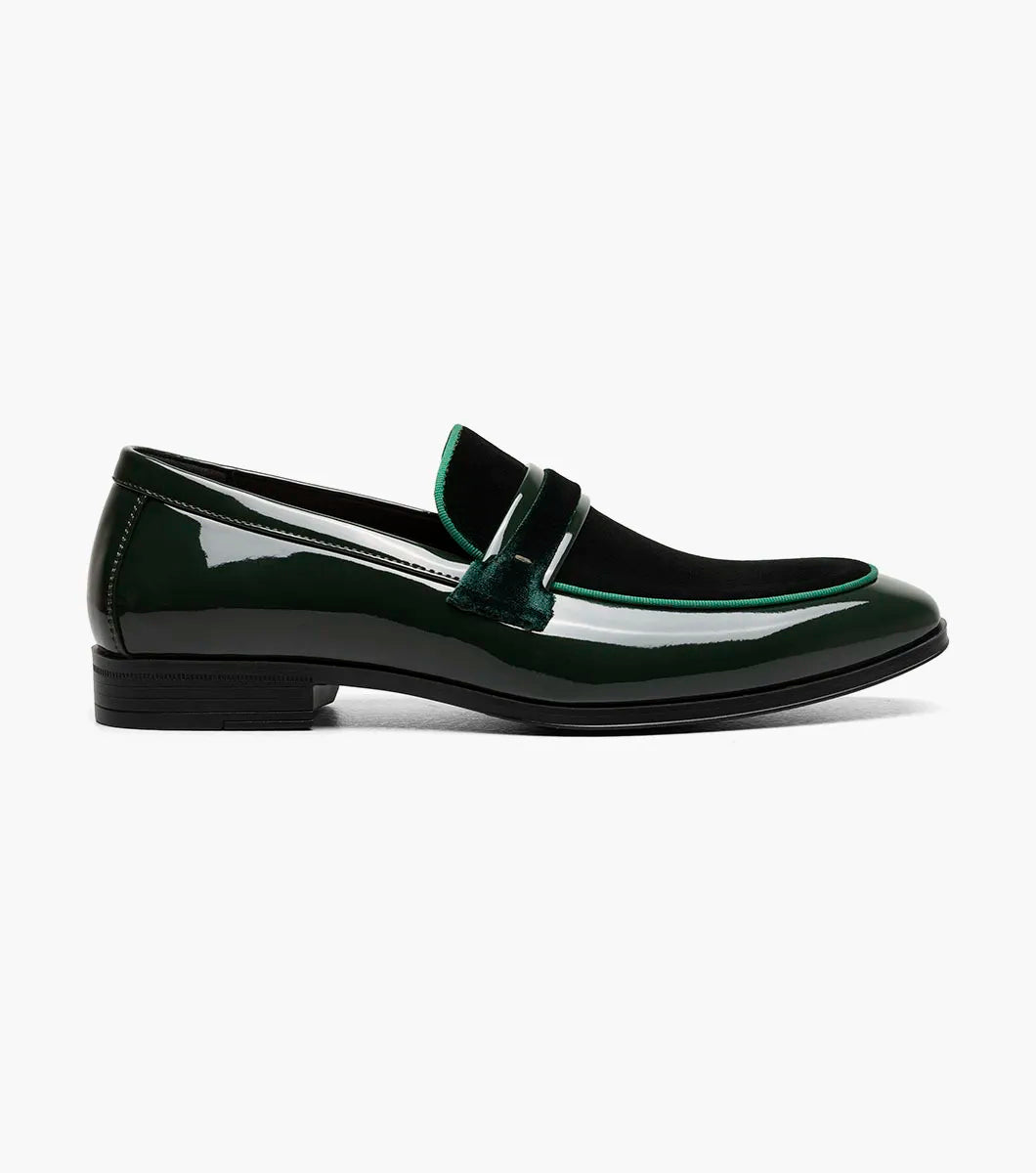 The Stacy Adams Spratley Moc Toe Saddle Slip On in dark green patent leather features a black sole, elegant velour upper, and velvet accents along the upper and tongue.