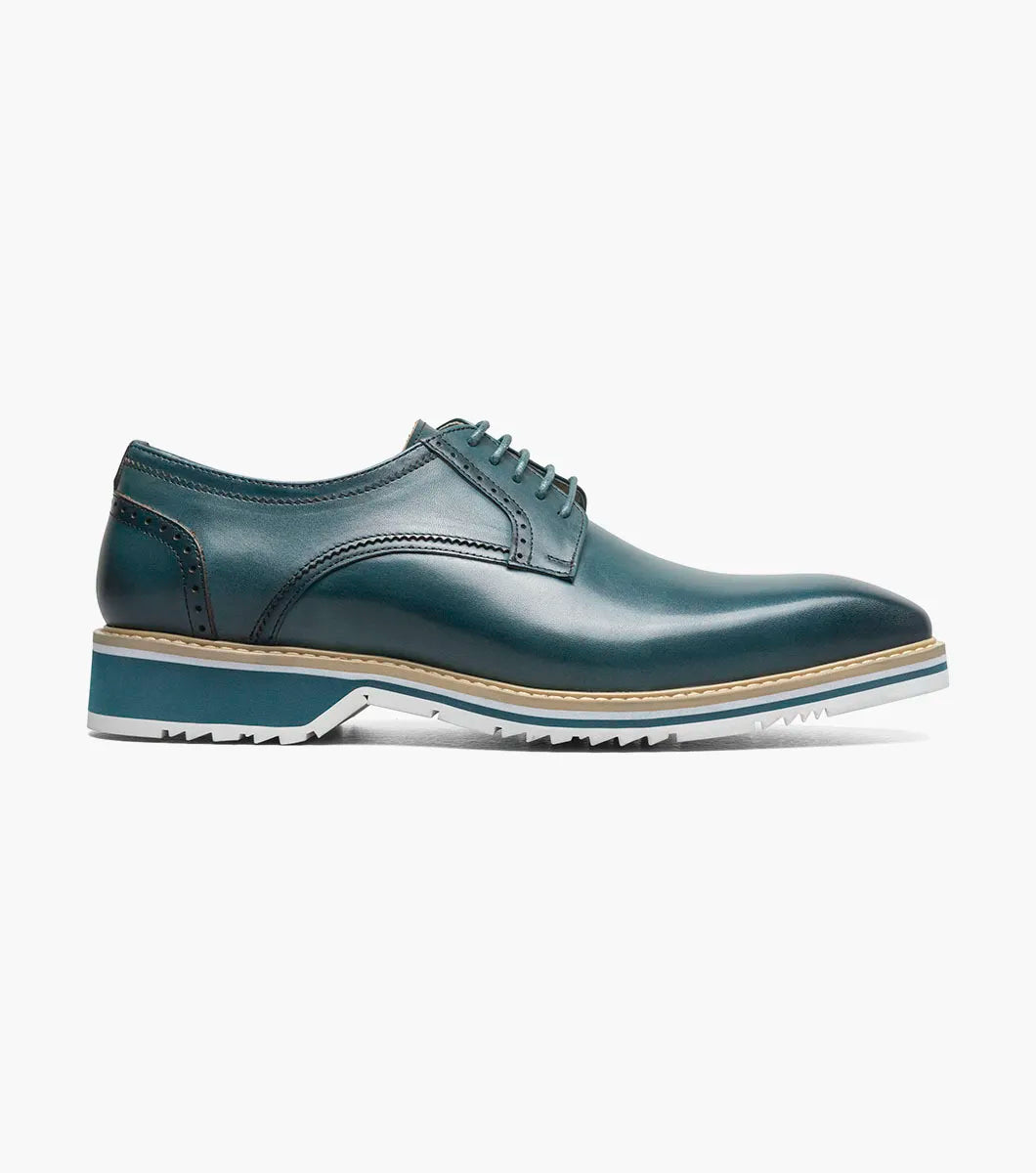 The Stacy Adams Barringer Plain Toe Oxford (Teal, 25722-444) features a rounded toe, tan welt, decorative stitching, leather upper, cushioned insole, and white rubber sole. Shown solo against a plain white background.