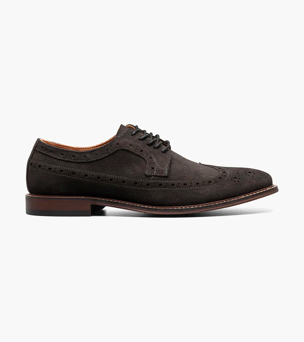 The Stacy Adams Marligan Wingtip Oxford in dark gray features brogue detailing, black laces, and a low stacked heel, displayed on a plain white background. Brand: STACY ADAMS. Style: 25616-011.