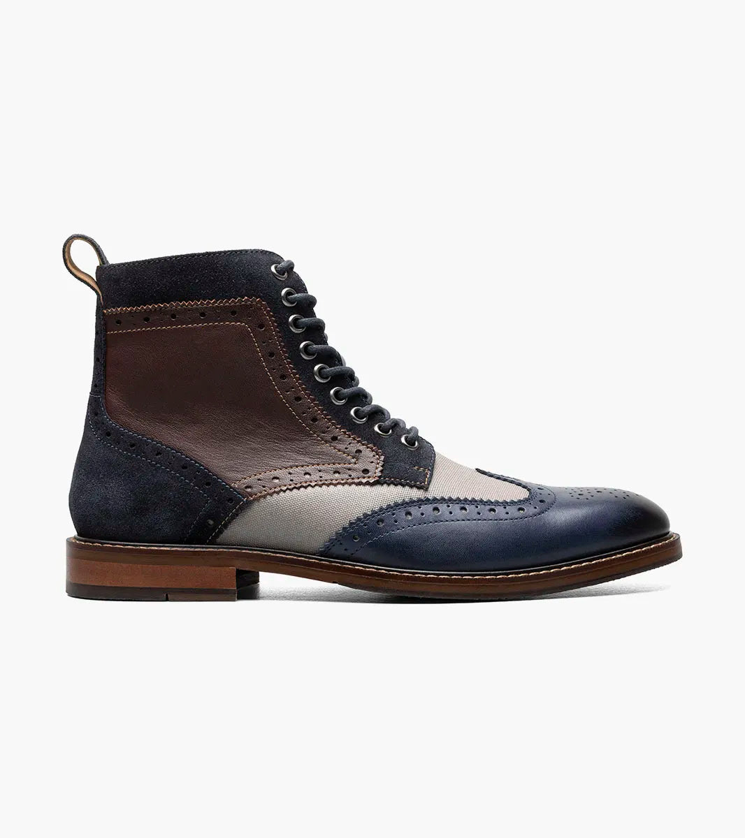 The STACY ADAMS Finnegan Wingtip Lace Up Boot (Navy Multi) features navy, brown, and gray leather with perforated details, suede accents, memory foam insole for comfort, and a classic brown sole.