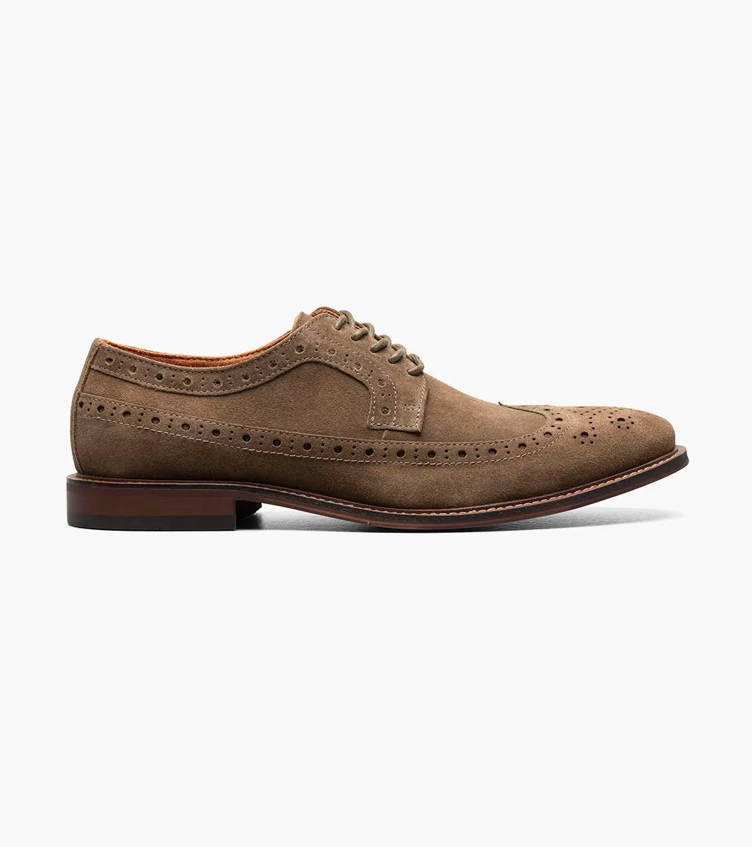 The Stacy Adams Marligan Wingtip Oxford - Mocha (25616-216) is a men's brown suede leather dress shoe featuring decorative perforations, brown laces, and a low stacked heel displayed on a white background.
