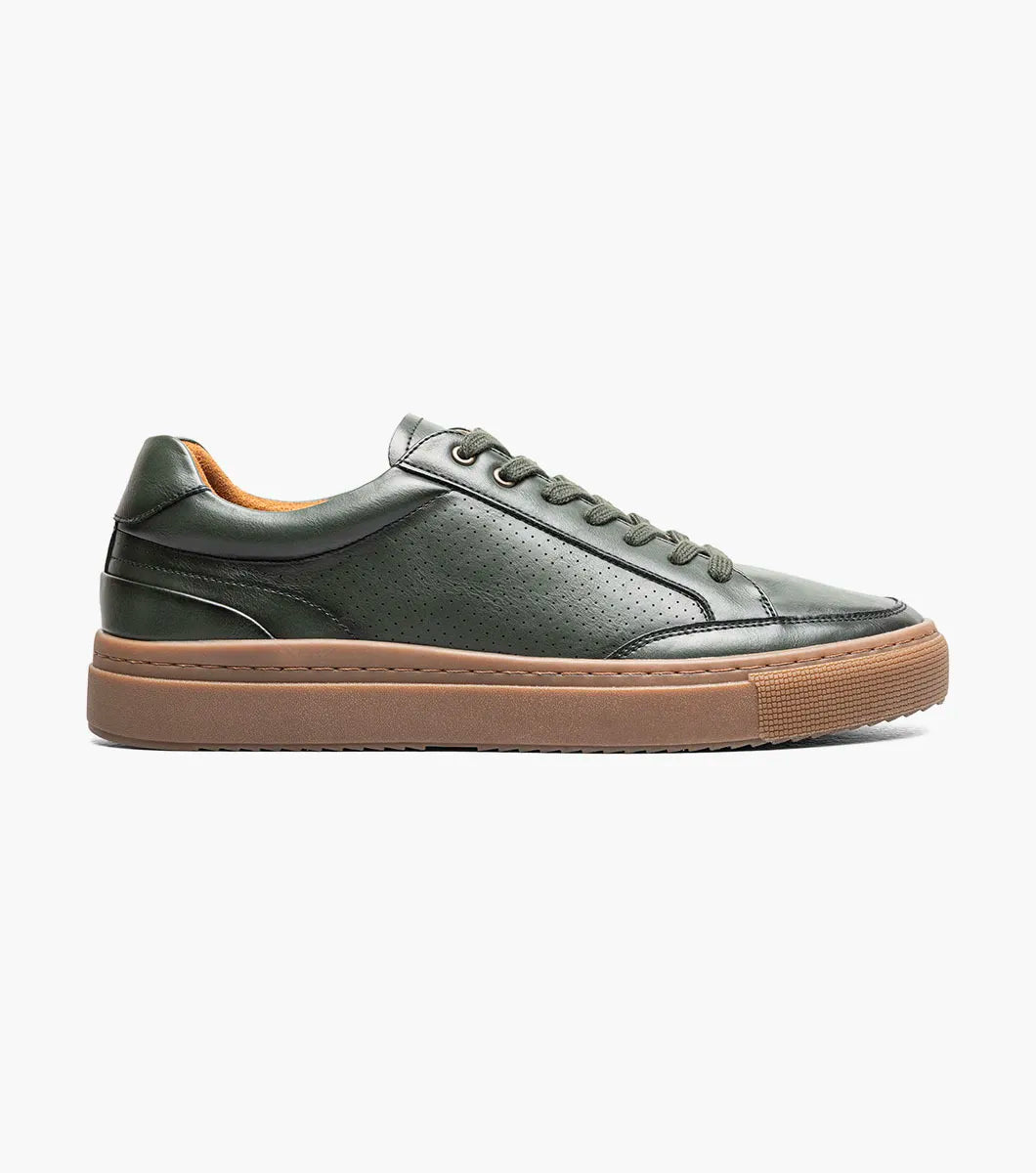 The Stacy Adams Dorian Lace To Toe Sneaker in green (style 25749-300) is displayed against a white background. This stylish STACY ADAMS shoe features matching green laces, a brown rubber sole, and anatomical arch support for enhanced comfort.