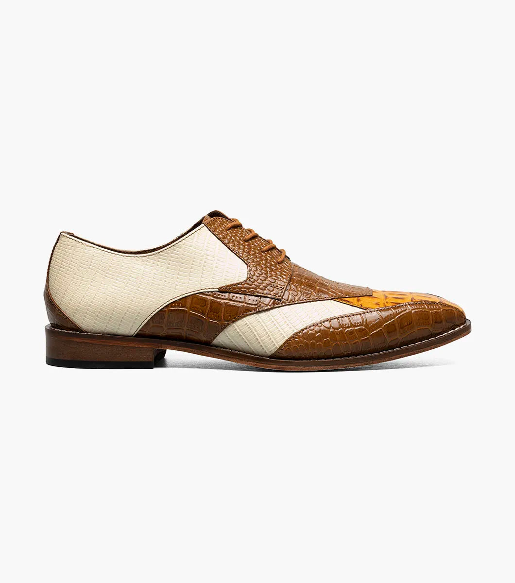 The Stacy Adams Tristano Modified Bike Toe Oxford in Tan Multi features crocodile print leather, lace-up closure, low heel, pointed toe, and anatomical arch support for comfort.