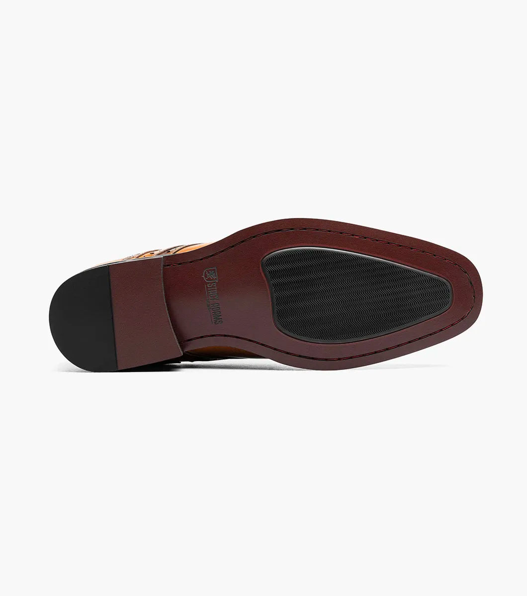 The Stacy Adams Alexander Plain Toe Oxford in tan (25791-240) is a single men’s dress shoe made from brown calf leather, featuring elegant brogue detailing and laces. Photographed against a white background, it offers enhanced comfort with Memory Foam cushioning.