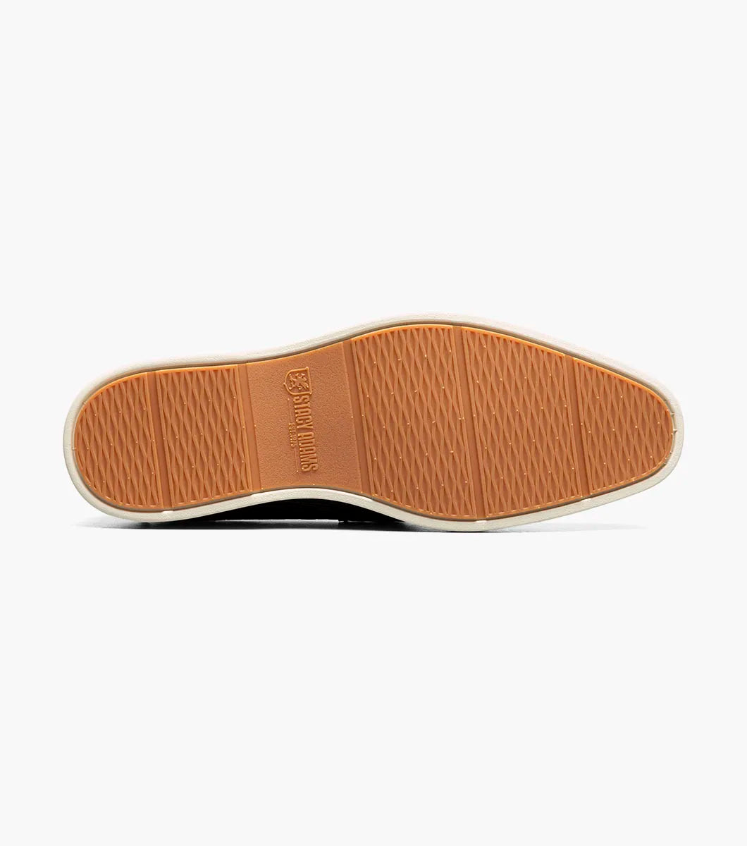 The STACY ADAMS Salyer Moc Toe Bit Slip On (25692-001) features black textured leather, a metal bit detail, and a white sole—perfect for dress occasions, shown on a plain white background.