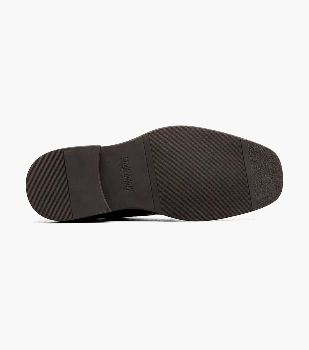 Introducing the Stacy Adams Evan Moc Toe Oxford in brown (style 25789-200)—a men’s dress shoe from STACY ADAMS featuring a moc toe design, black laces, a rounded toe, and a contrasting black sole. This stylish oxford is equipped with a Memory Foam footbed for enhanced comfort and is showcased against a white background.