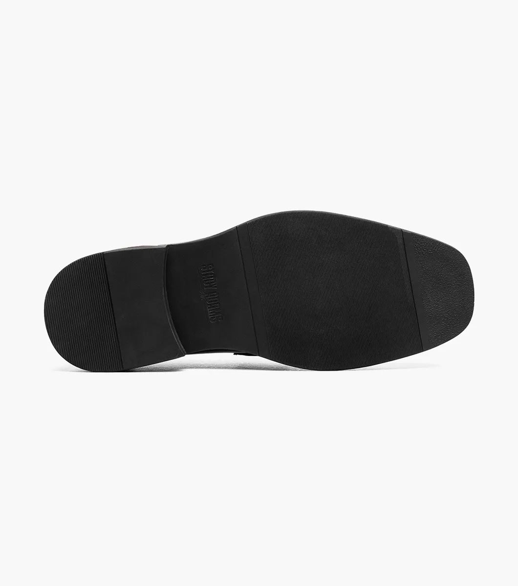 Introducing the Stacy Adams Everett Moc Toe Penny Slip On (25790-963): crafted by STACY ADAMS, this men’s dress shoe features a sophisticated design with a black sole, brown sides, and a tan upper. Accented by a classic penny strap across the top, it offers timeless style and comfort thanks to its cushioned insole—making it an ideal refined slip-on for all-day wear.