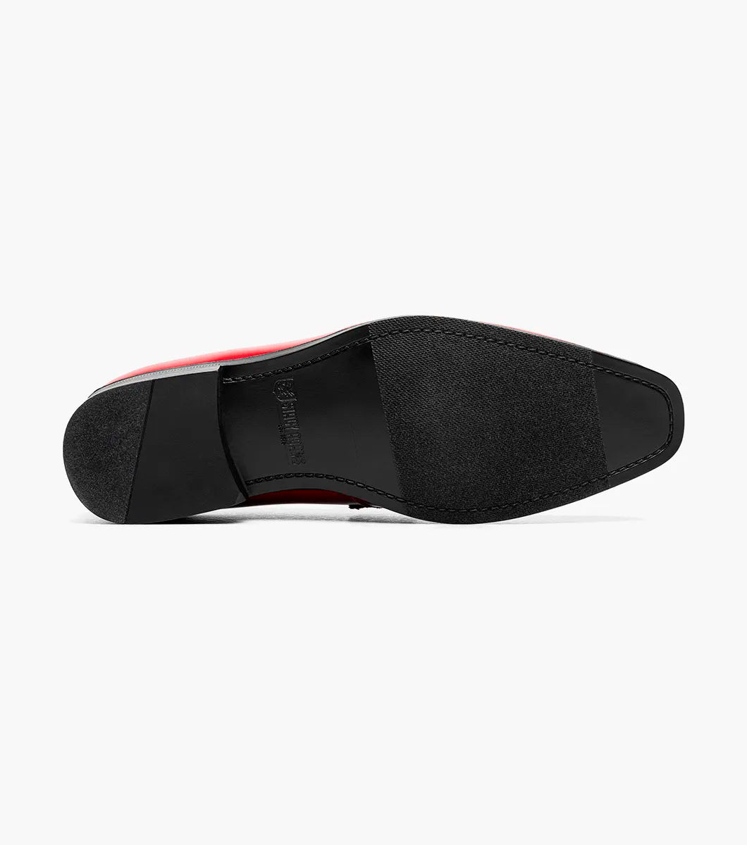 The Stacy Adams Spratley Moc Toe Saddle Slip On in red features a velour upper, matte strap, and black sole. This single shiny loafer (25686-600) by STACY ADAMS is displayed on a white background.