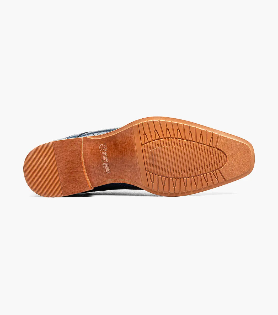 The Stacy Adams Hobson Cap Toe Oxford (25764-400) is a single blue dress shoe with a laser-etched diamond calf leather pattern, lace-up closure, brown sole, and sleek pointed toe.