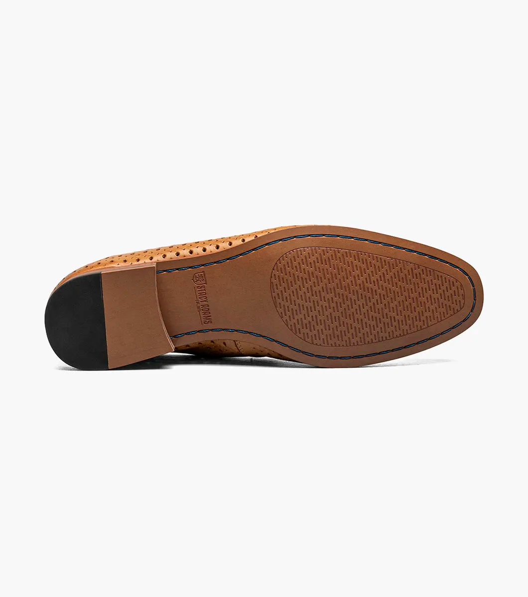 The STACY ADAMS Winden Moc Toe Perf Slip On in Natural (25645-280) is a men's summer shoe with perforations, memory foam insole, low stacked heel, and a sleek silhouette. Shown on a white background.