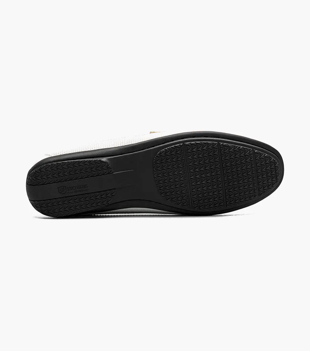 The STACY ADAMS Colton Moc Toe Bit Slip On (White, 25760-100) is a men's leather loafer with a silver bit detail, black sole, patterned heel lining, and cushioned footbed for all-day comfort.