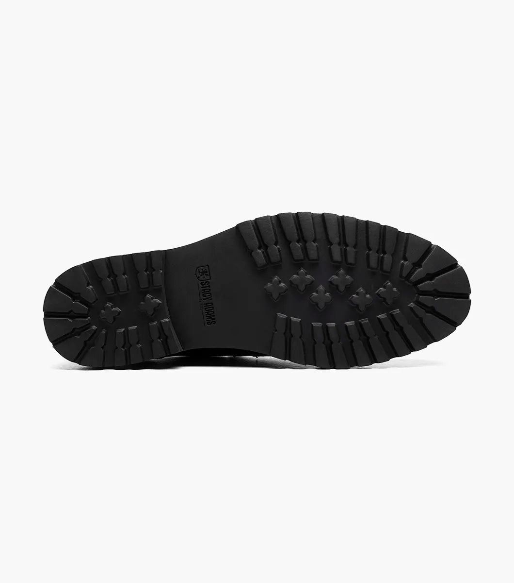 The Stacy Adams Hayes Moc Toe Penny Slip On in navy features a dark blue leather upper, textured black EVA sole, classic penny slot, subtle stitching, and a comfortable RedZone footbed.