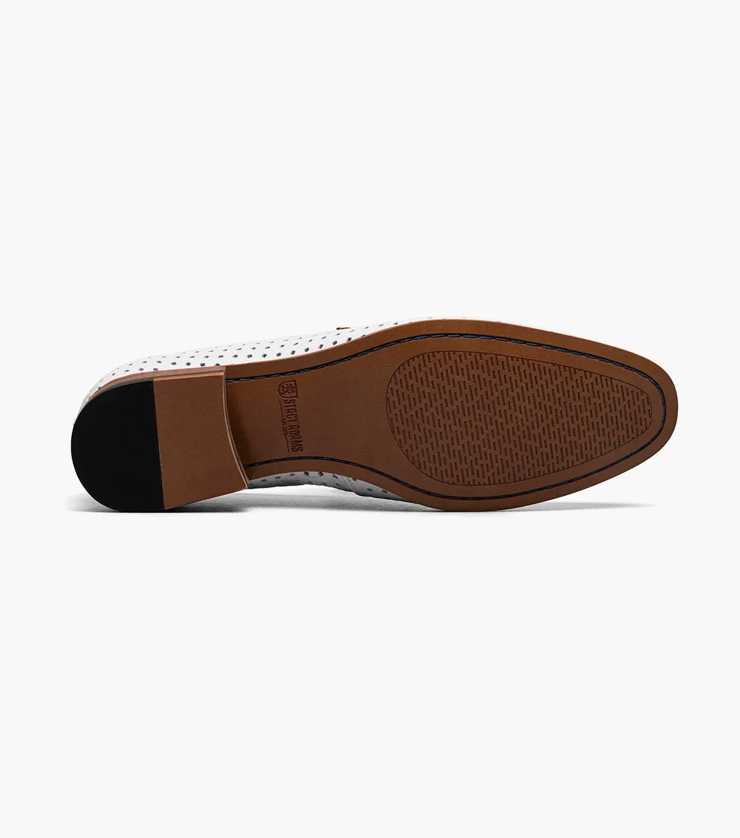 The Stacy Adams Winstead Moc Toe Saddle Slip On features a white leather upper with perforated details, light brown trim, and a low wooden heel. Shown is the STACY ADAMS style 25704-100 against a plain white background.