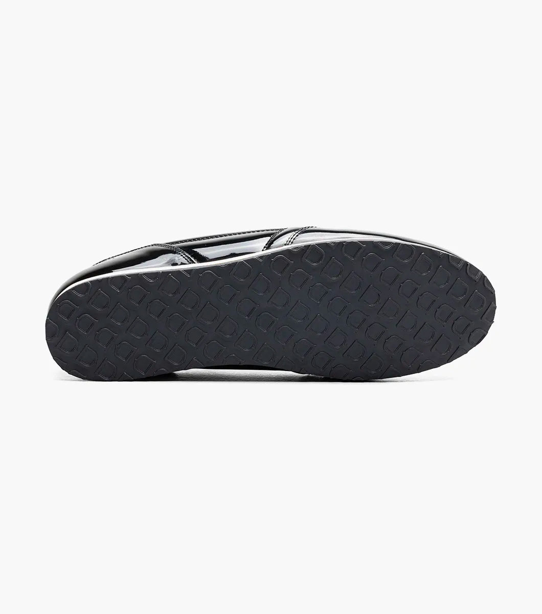 The STACY ADAMS Action 150 Sporty Lace Up in Black Patent (25797-004) features black laces, a white sole, and decorative stitching—presented on a white background for a sleek modern update to men’s casual footwear with a sporty lace-up design.