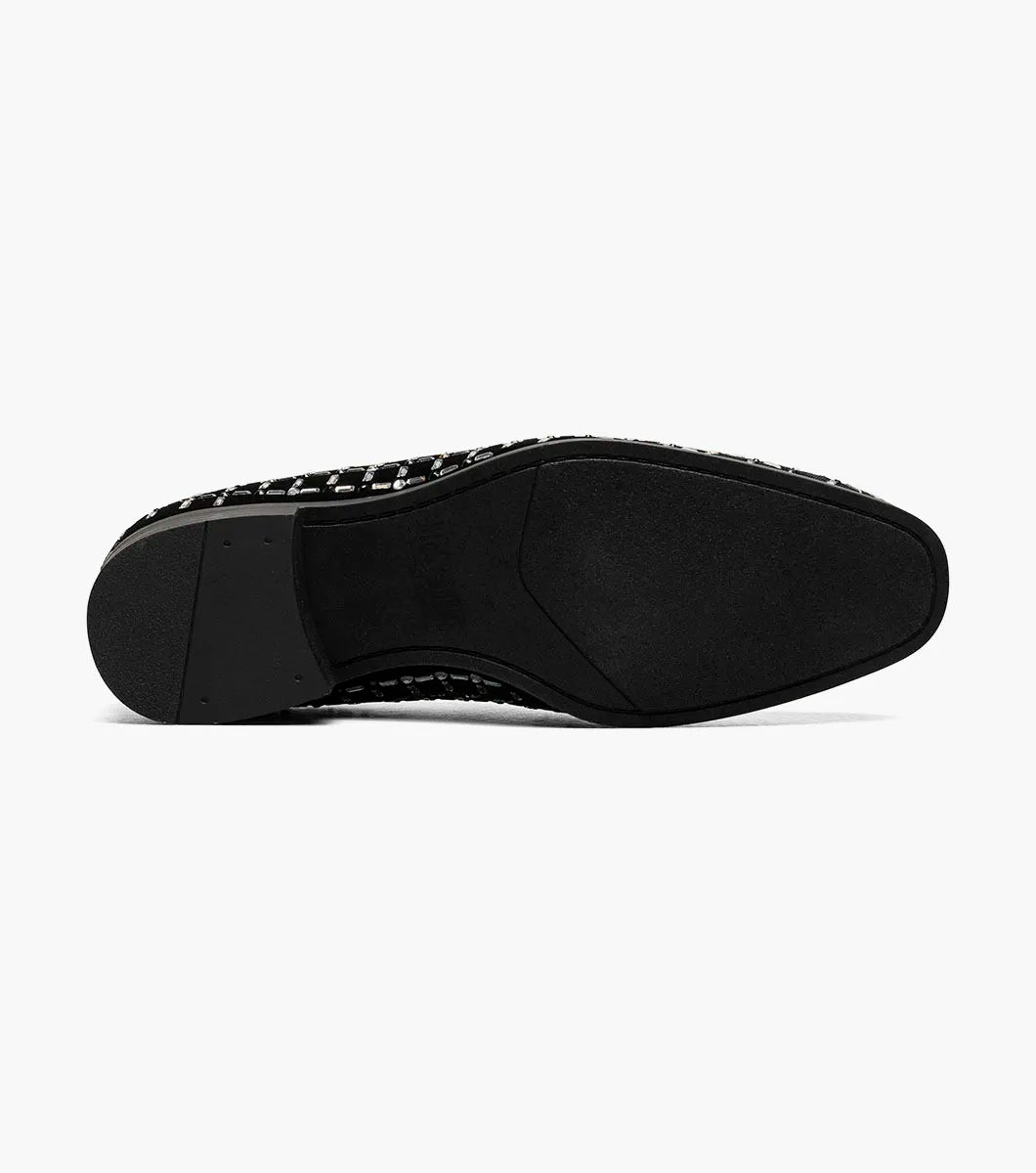 The Stacy Adams Stallford Rhinestone Slip On in Black Multi features a low heel, silver and gold grid-patterned studs, and anatomical arch support, blending dressy style with casual comfort.