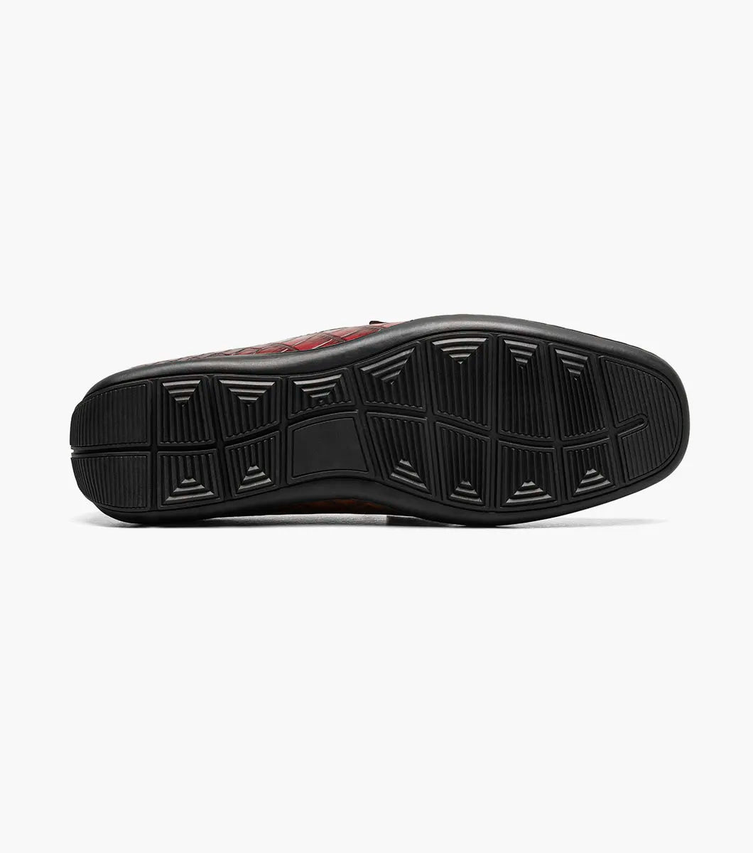 The STACY ADAMS Embrey Moc Toe Bit Slip On in Wine (25703-609) features a single red crocodile print loafer with a metal bit detail on the man-made upper, shown against a white background.