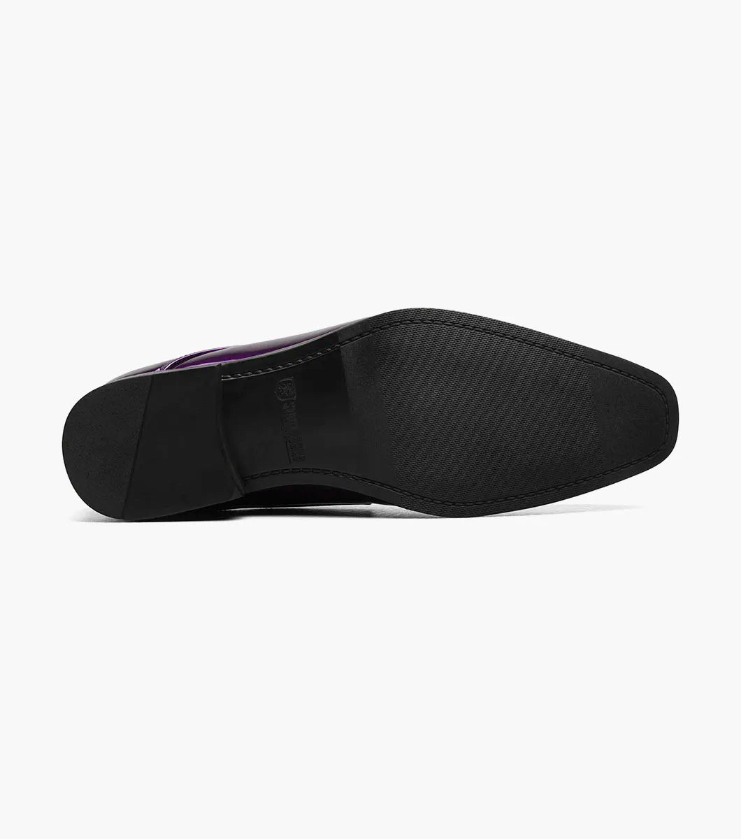 The STACY ADAMS Sprague Moc Toe Bit Slip On (25732-542) is a glossy purple loafer with a hexagonal quilted velvet upper, gold metal bit detail, and memory foam insole for comfort.