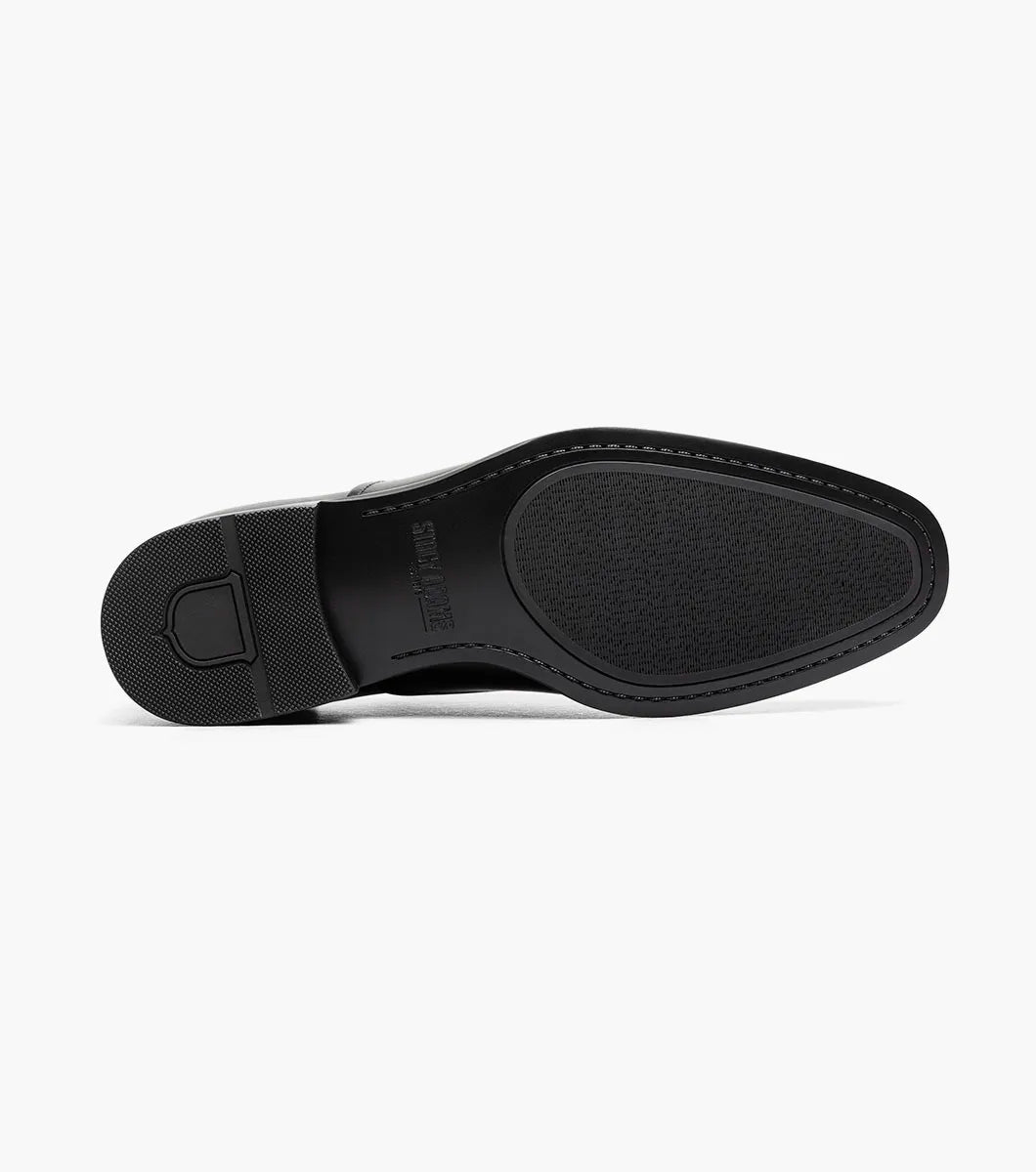 The STACY ADAMS Langford Plain Toe Oxford in black (25795-001) is a classic leather dress shoe featuring perforated toe detailing and black laces, designed to provide both style and comfort for any formal occasion. Shown on a white background.