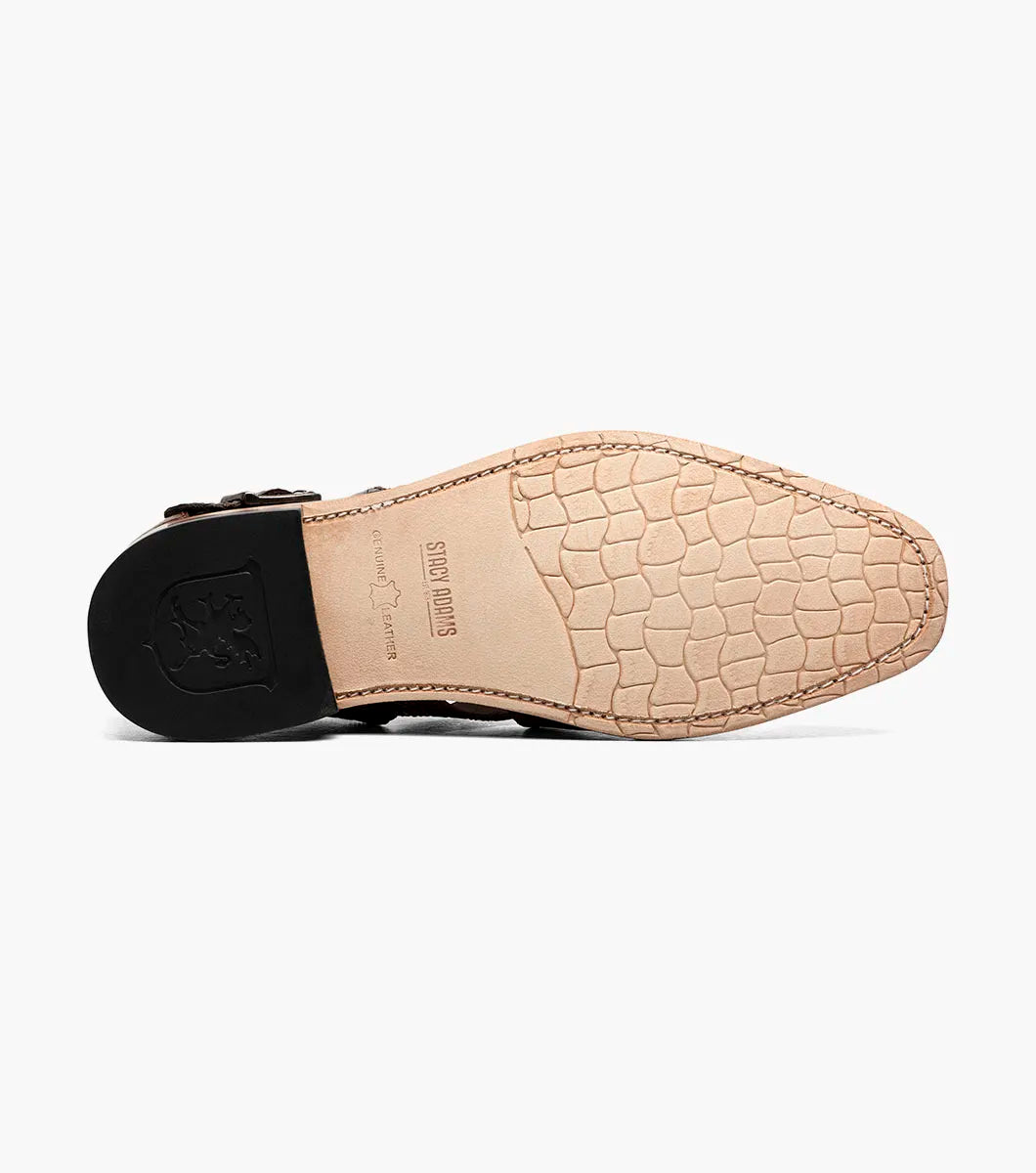 The STACY ADAMS Calandro City Sandal (Cognac, 25695-221) is a brown genuine leather dress shoe with a crocodile pattern, cushioned footbed, side buckle, and closed toe, displayed on a white background.